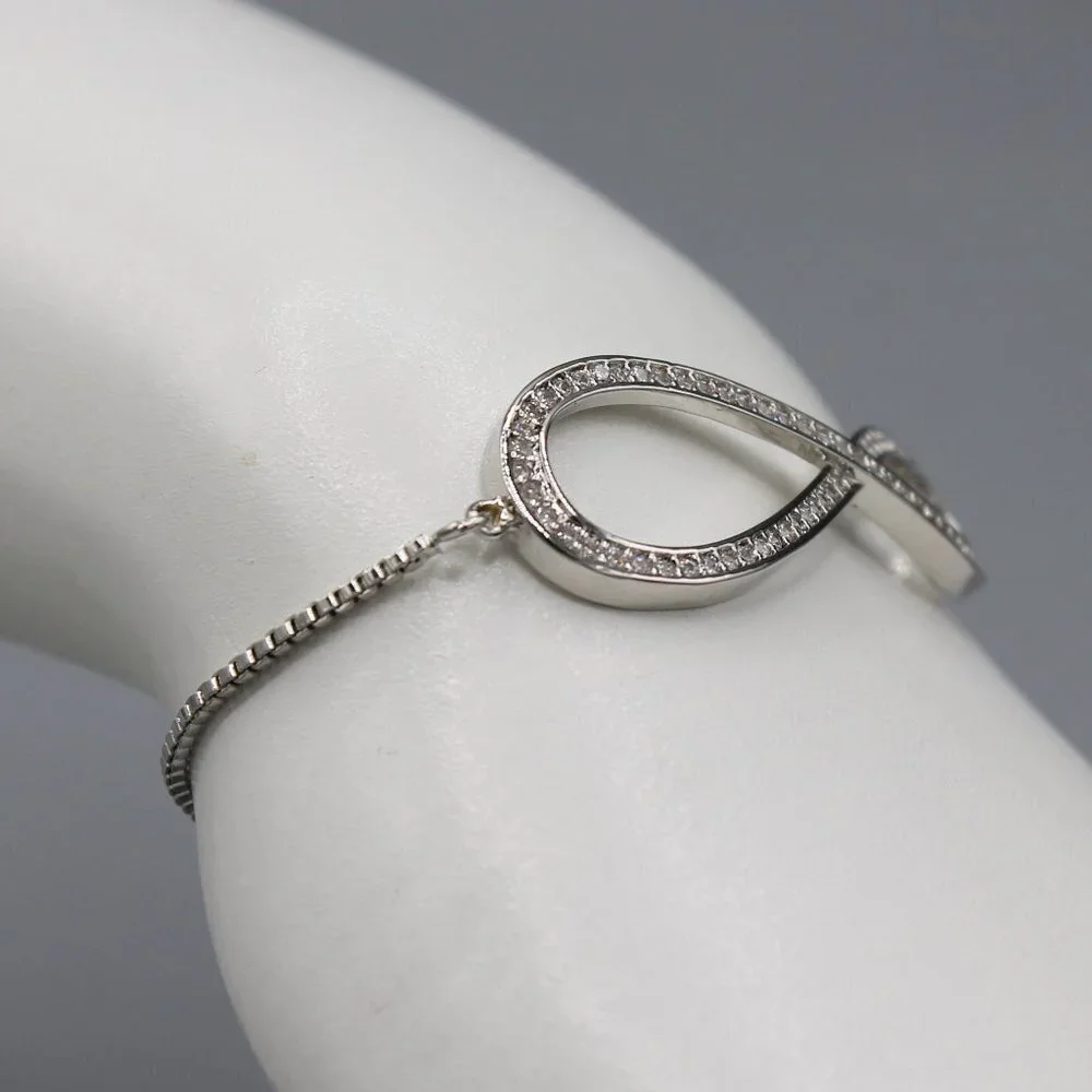 Jewelry bracelet infinity style white gold tone with stones sparkly adjustable